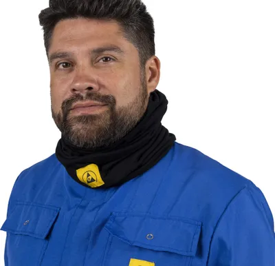 A man wearing a blue work uniform and a black neck gaiter with a yellow logo.