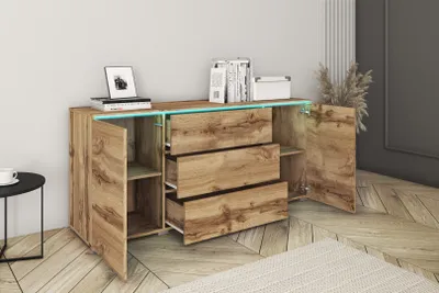 A wooden sideboard with drawers and doors is shown in a room.