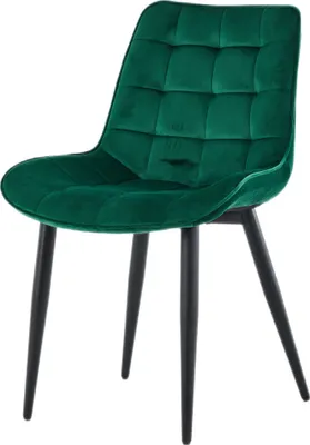 A single green velvet chair with black legs against a white background.