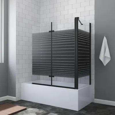 A modern bathroom with a white bathtub and a black framed shower screen with horizontal slats.