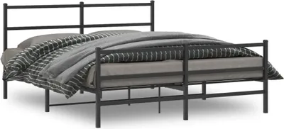 A black metal bed frame with bedding.