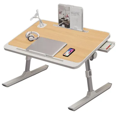 A portable laptop desk with various accessories on top.