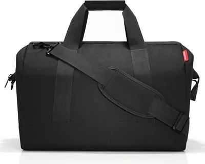 A black duffel bag is shown against a white background.