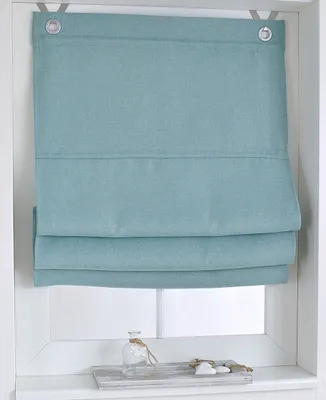 A turquoise Roman blind is shown hanging in a window frame, with a small decorative tray on the windowsill below.