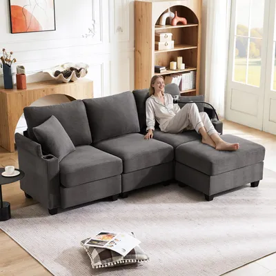 Zdjęcie produktu dla Sofa narożne Fortuna o kształcie litery L, modułowe, 3-osobowe, z podnóżkiem, uchwytami na napoje, ładowarką USB, półką na podłokietniku i 2 poduszkami, idealne do salonu, biura lub mieszkania, kolor: ciemnoszary