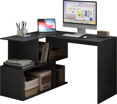 A black L-shaped desk with shelves, a laptop, a desktop monitor, keyboard, mouse, and a speaker.