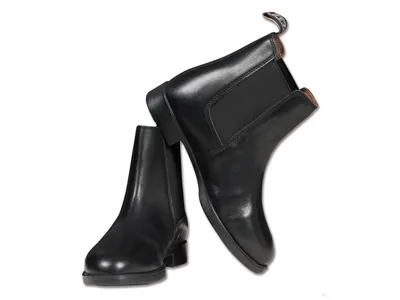 A pair of black leather Jodhpur boots on a white background.