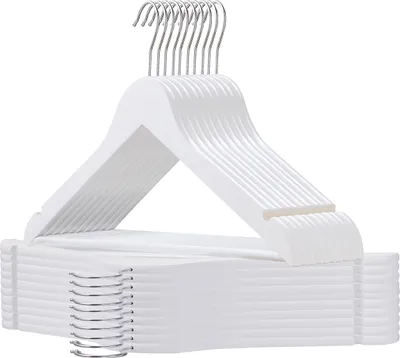 A stack of white wooden hangers.