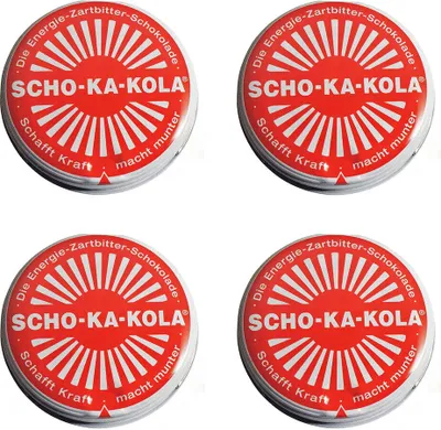 Four round chocolate tins arranged in a 2x2 grid against a white background.