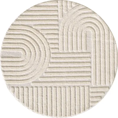 A round rug with a geometric pattern of raised lines.