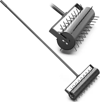 A black lawn aerator with a long handle, shown against a white background.