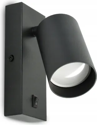 A black metal wall lamp with a swiveling cylindrical head, mounted on a rectangular base with a switch.