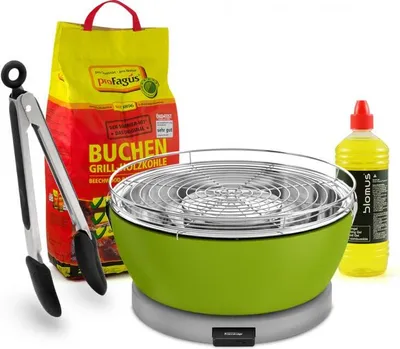 A set of barbecue accessories including a green table grill, a bag of charcoal, tongs, and a bottle of lighter fluid, arranged on a white background.