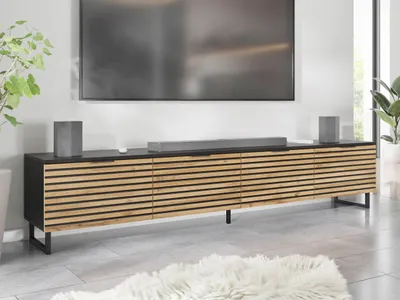 A modern living room with a TV and entertainment unit.