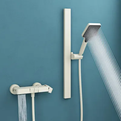 A modern white shower system with a rainfall showerhead and a handheld showerhead, mounted on a blue wall.