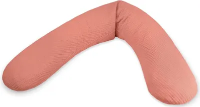 A coral-colored nursing pillow is shown against a white background.