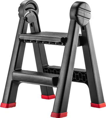 A black plastic step stool with red feet is shown against a white background.