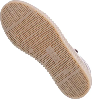 The sole of a brown shoe is shown against a white background.