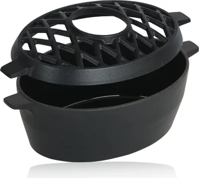 A black cast iron humidifier for a BBQ or oven.