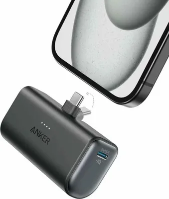 A black Anker Nano power bank is shown connected to a smartphone.