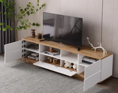Imagen del producto de Mueble de TV STILVORA con dos compartimentos abiertos, acabado en blanco, ideal para el salón. Bajo de TV con efecto madera, fabricado en MDF de alta calidad