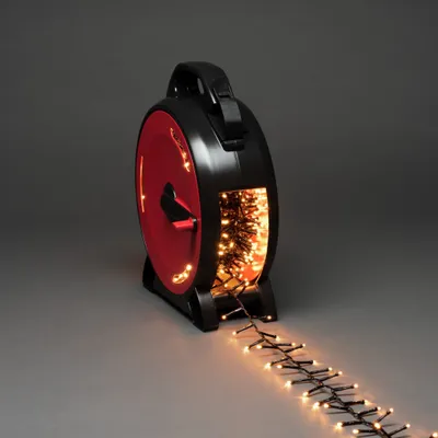 Produktbild von Konstsmide Micro LED Compactlights mit Kabelaufroller, 1200 bernsteinfarbene Dioden, 30V, Außen (IP44), schwarzes Kabel - 3850-800