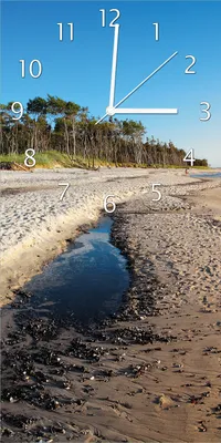 Produktbild von Wallario Design Wanduhr Einsamer Strand am Meer - Blauer Himmel aus Echtglas, Größe 30 x 60 cm