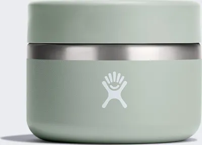 A close-up studio shot of a green Hydro Flask insulated food jar.