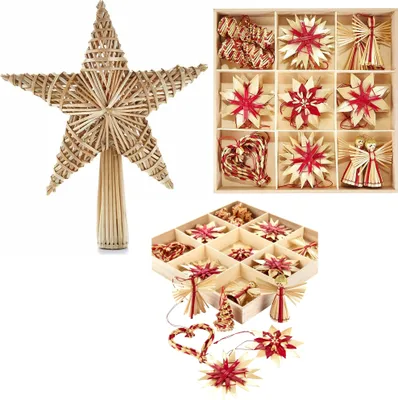 A collection of straw Christmas ornaments, including a tree topper star, and various other star and heart-shaped ornaments, along with angel and tree figures, displayed in wooden boxes and arranged around them.