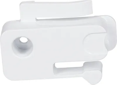 A white plastic stopper for a freezer compartment door.