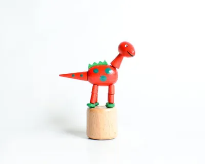 Zdjęcie produktu dla Drewniana zabawka Figurka dinozaura czerwona Wysokość = 9 cm Figurka dinozaura czerwona