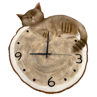 A decorative wall clock shaped like a log slice with a sleeping cat on top.
