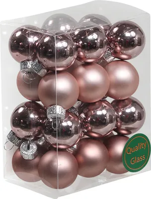 A clear plastic box filled with rose gold Christmas tree ornaments.