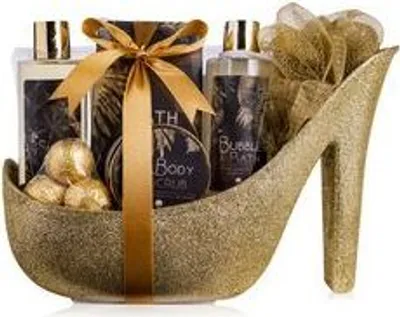 A gift set for women presented in a golden high-heeled shoe.