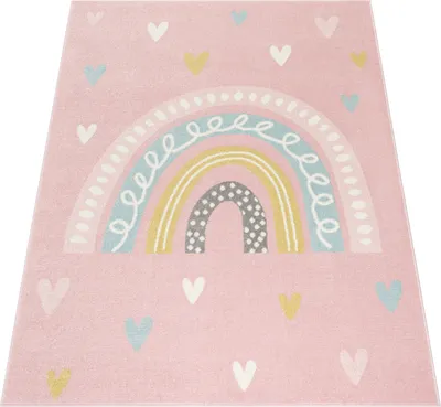A pink rug with a rainbow and heart pattern.