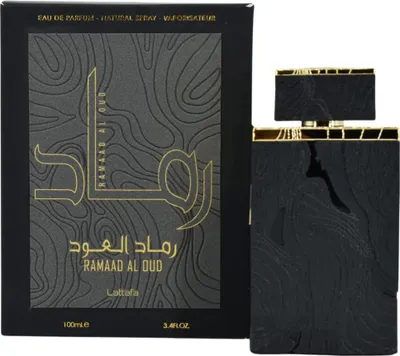 A black perfume box and bottle with gold accents, presented against a white background.