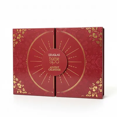 A closed red advent calendar with gold floral patterns and a circular design in the center.
