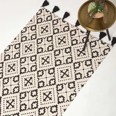 Produktbild von HOMESCAPES Handgewebter Baumwollteppich Reva - 160 x 230 cm, schwarz-creme gemustert