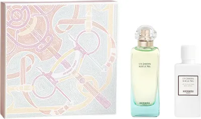 A gift set of Hermès perfume and body lotion with decorative packaging.