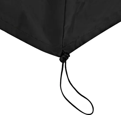 A close-up view of the bottom edge of a black cover, showing a drawstring and toggle.