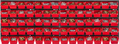 A wall-mounted storage system with multiple red bins filled with various hardware items.