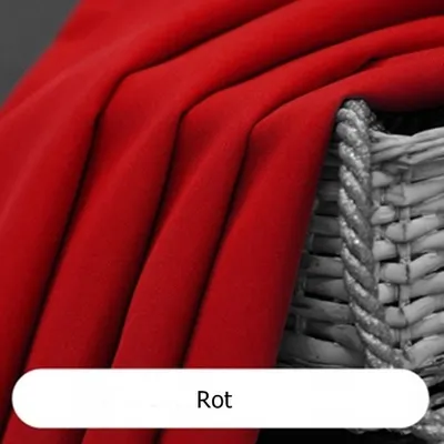 A close-up of red fabric draped over a wicker basket.