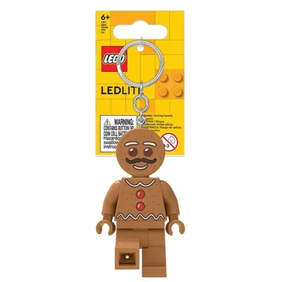A LEGO leuchtender Schlüsselanhänger - Iconic Gingerbread product displayed on a white background with its packaging.
