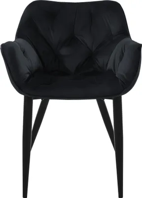 A black velvet dining chair with tufted upholstery and black legs, shown from the front on a white background.