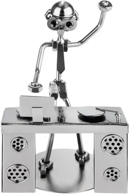 A metallic figurine of a DJ at a console with speakers.