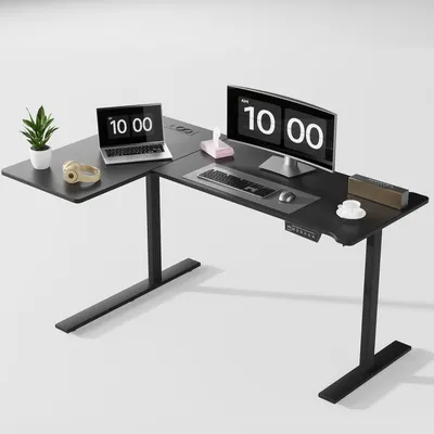 A black L-shaped standing desk with a laptop, monitor, keyboard, mouse, headphones, a plant, and a cup of coffee.