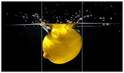 Produktbild von Wallario Herdabdeckplatte aus Glas, Größe 90 x 52 cm 3-teilig, Motiv Zitrone im Wasser - Frisches Obst für die Küche