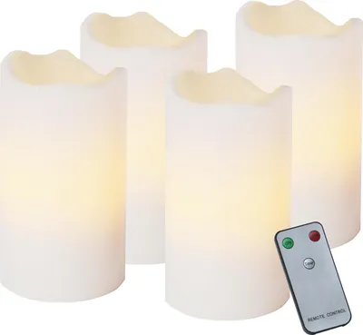 Four white LED candles and a remote control are arranged on a white background.