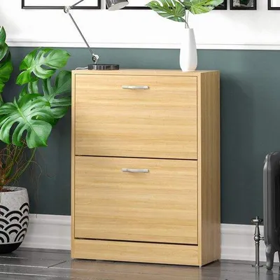 Image de Étagère à chaussures en chêne avec deux compartiments - Rangement pour chaussures intégré à une commode en bois.