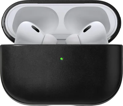 A pair of white AirPods Pro (2nd gen) are shown inside their black charging case. The case is open, revealing the interior and the earbuds. A small green LED light is visible on the front of the case.